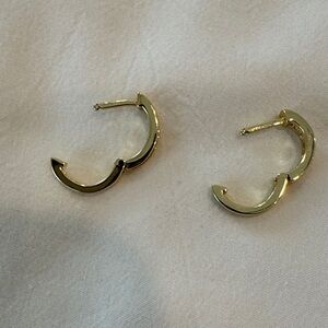 1/2” hoop earrings.  Gold color with clear rhinestones.